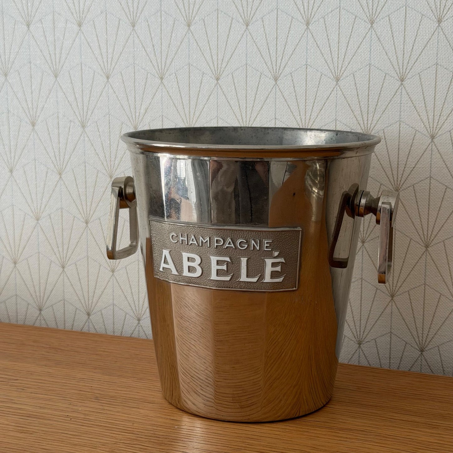 Side profile of ABELE champagne cooler with wood grip handles, full view