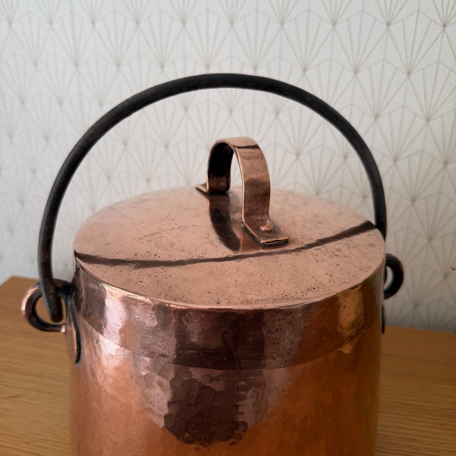 Overhead view of French copper cauldron with fitted copper lid and brass supports