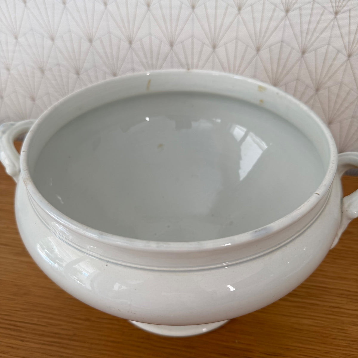 Interior view of antique French soup tureen with white glaze