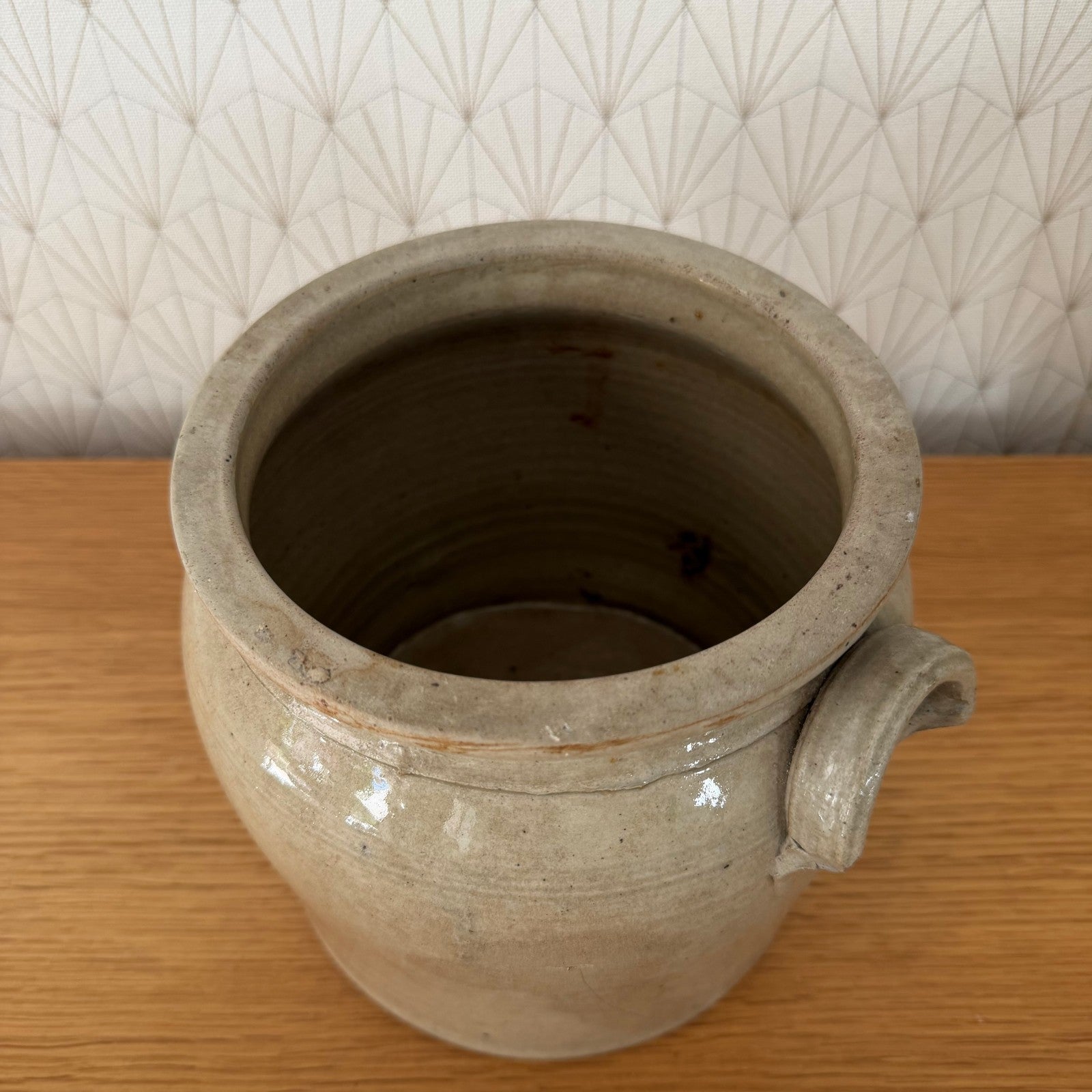 Top view of French antique stoneware confit pot showing wide open interior