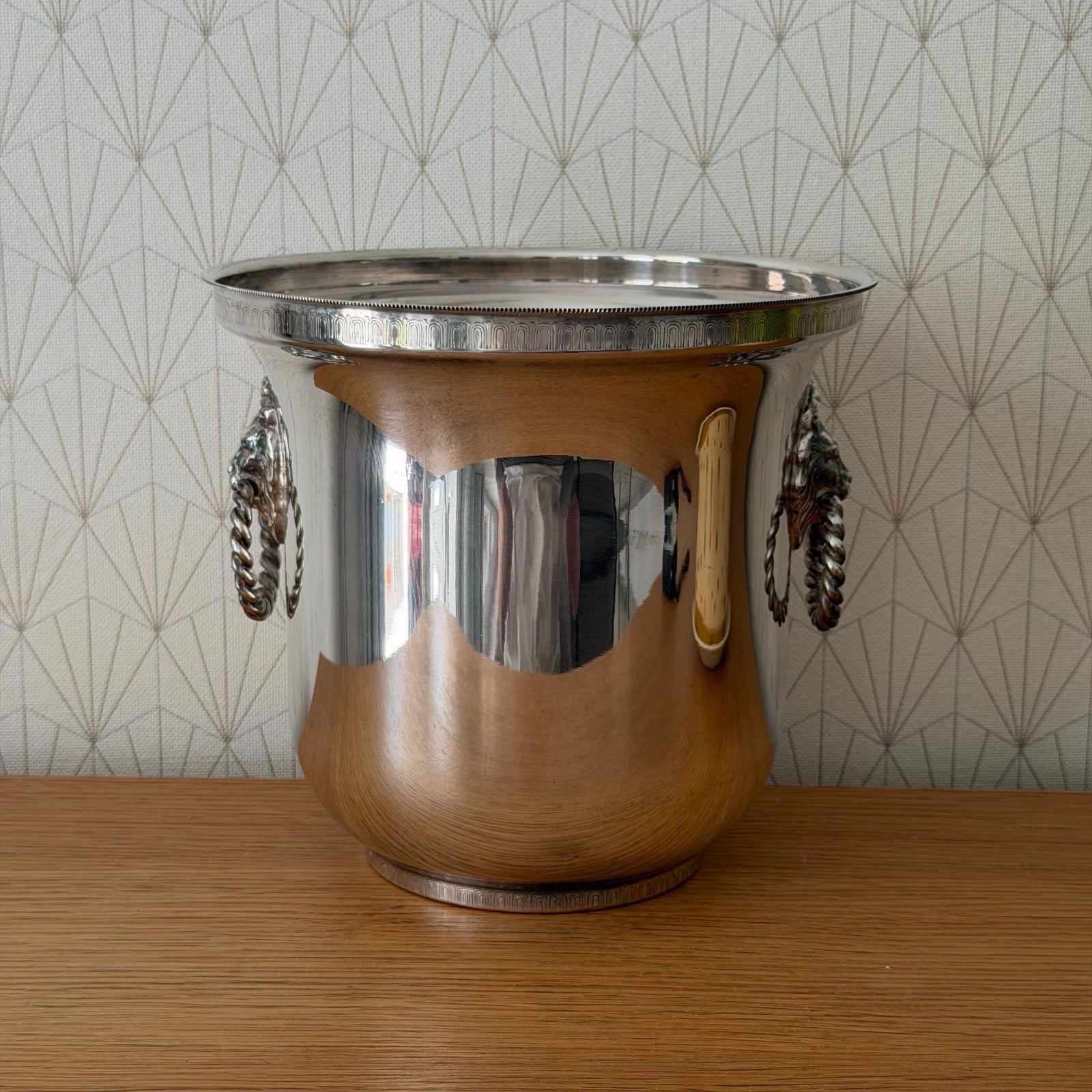 Vintage French silverplate ice bucket with decorative lion head handles and rope motif trim