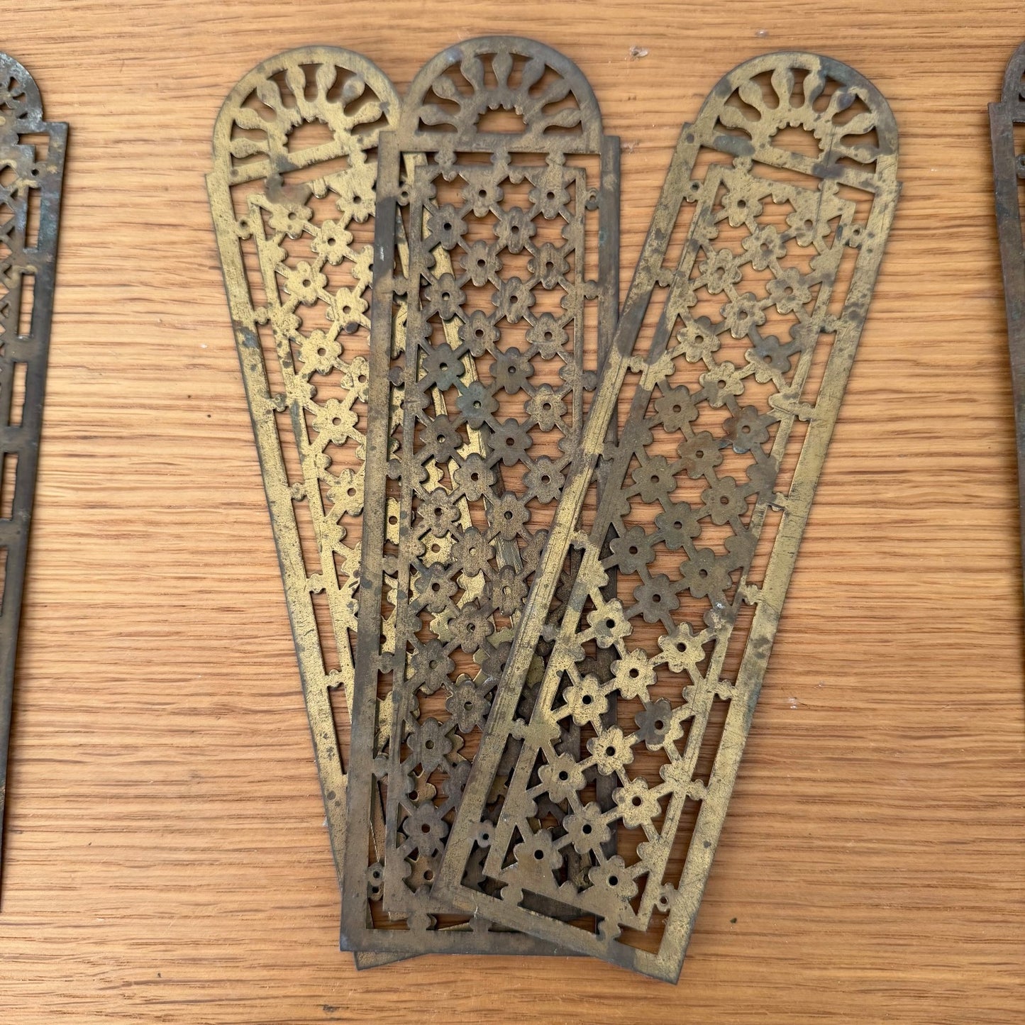 Ornate French antique brass finger plate with radiating sunburst and floral cutout design