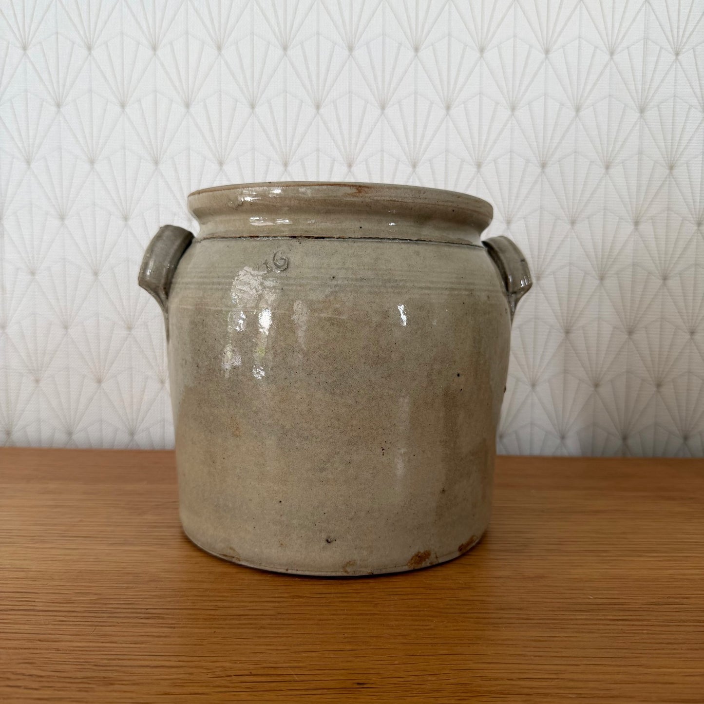 Interior view of beige-grey glazed French antique confit storage vessel