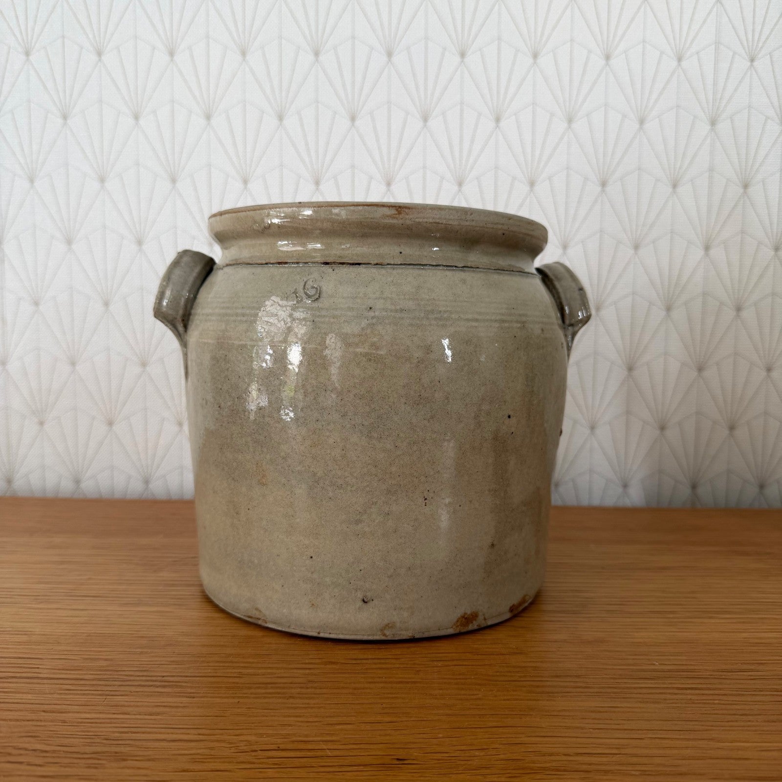 Interior view of beige-grey glazed French antique confit storage vessel