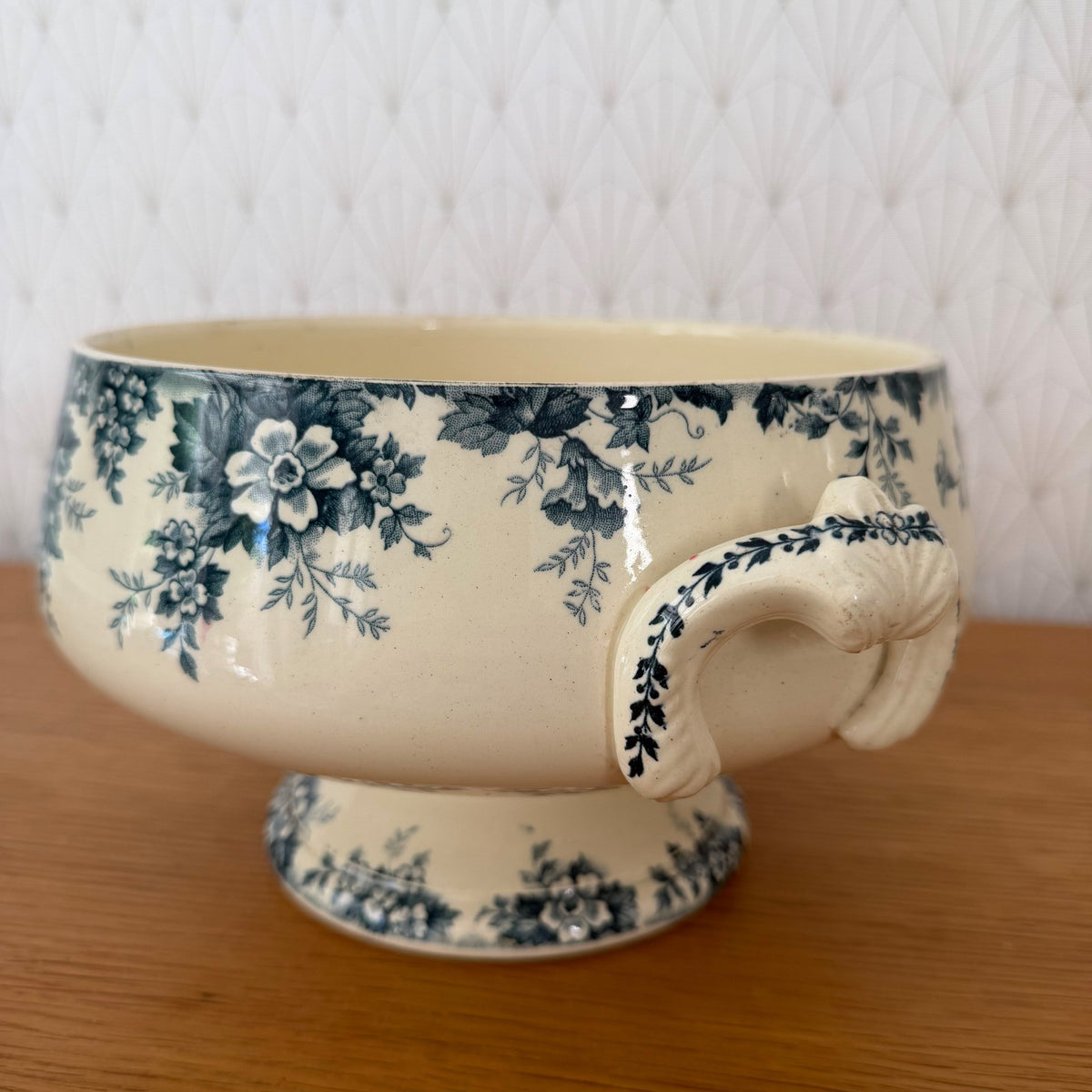 Front view of French transferware tureen base with cascading blue flowers and foliage pattern