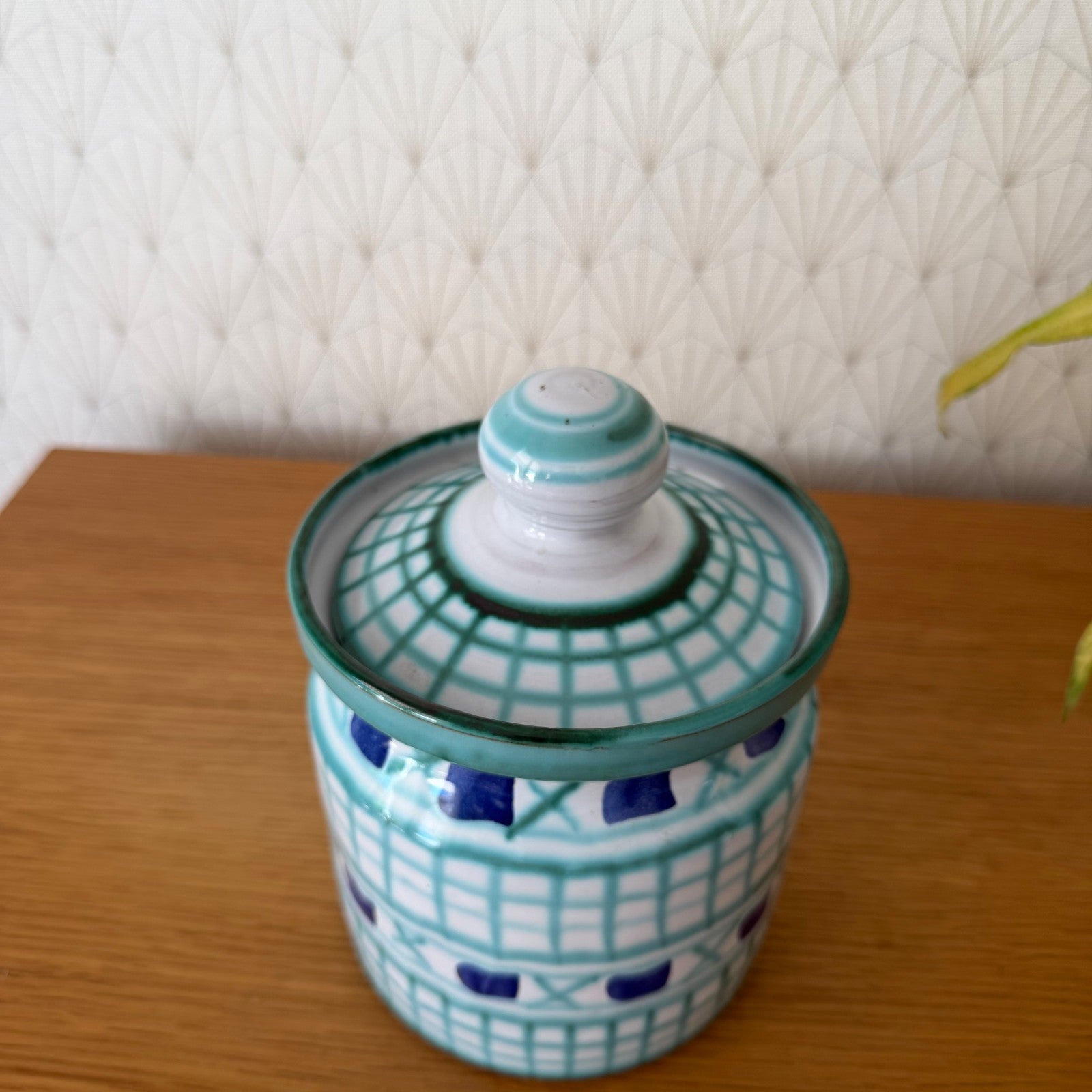 Top view of Robert Picault lidded jar displaying fitted turquoise lid with grid pattern