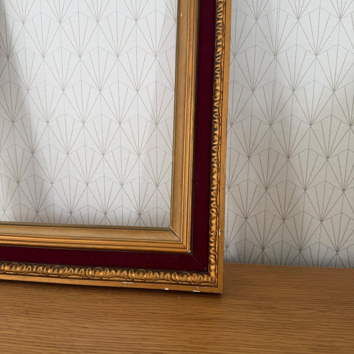Corner detail of ornate gilt gesso molding on French vintage gold picture frame