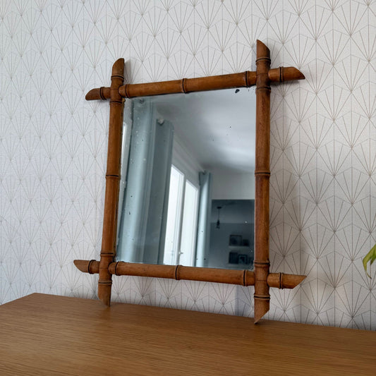 Antique French faux bamboo mirror with turned wood frame and decorative corner posts