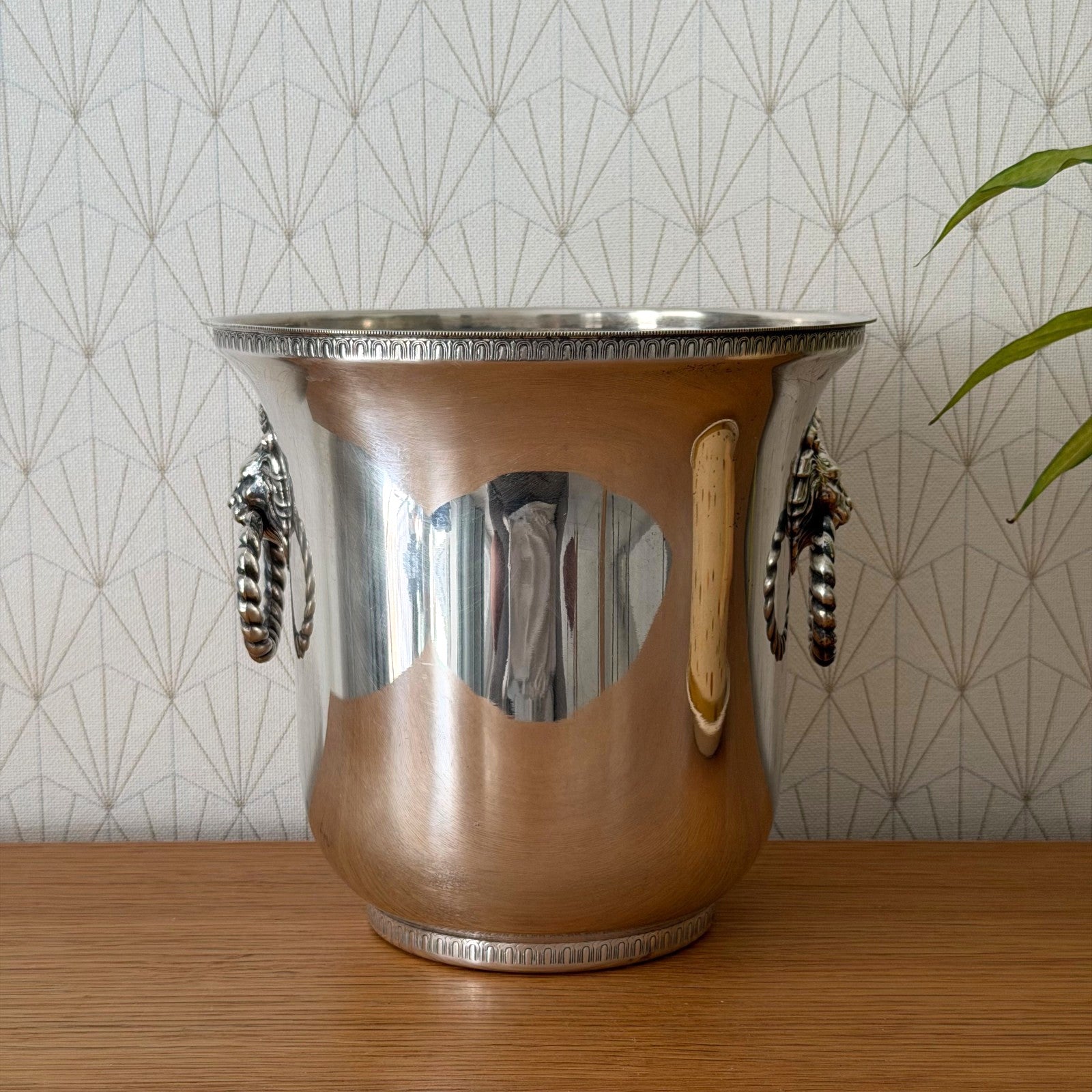 French silverplate champagne ice bucket with dual lion head ring handles and decorative rim banding