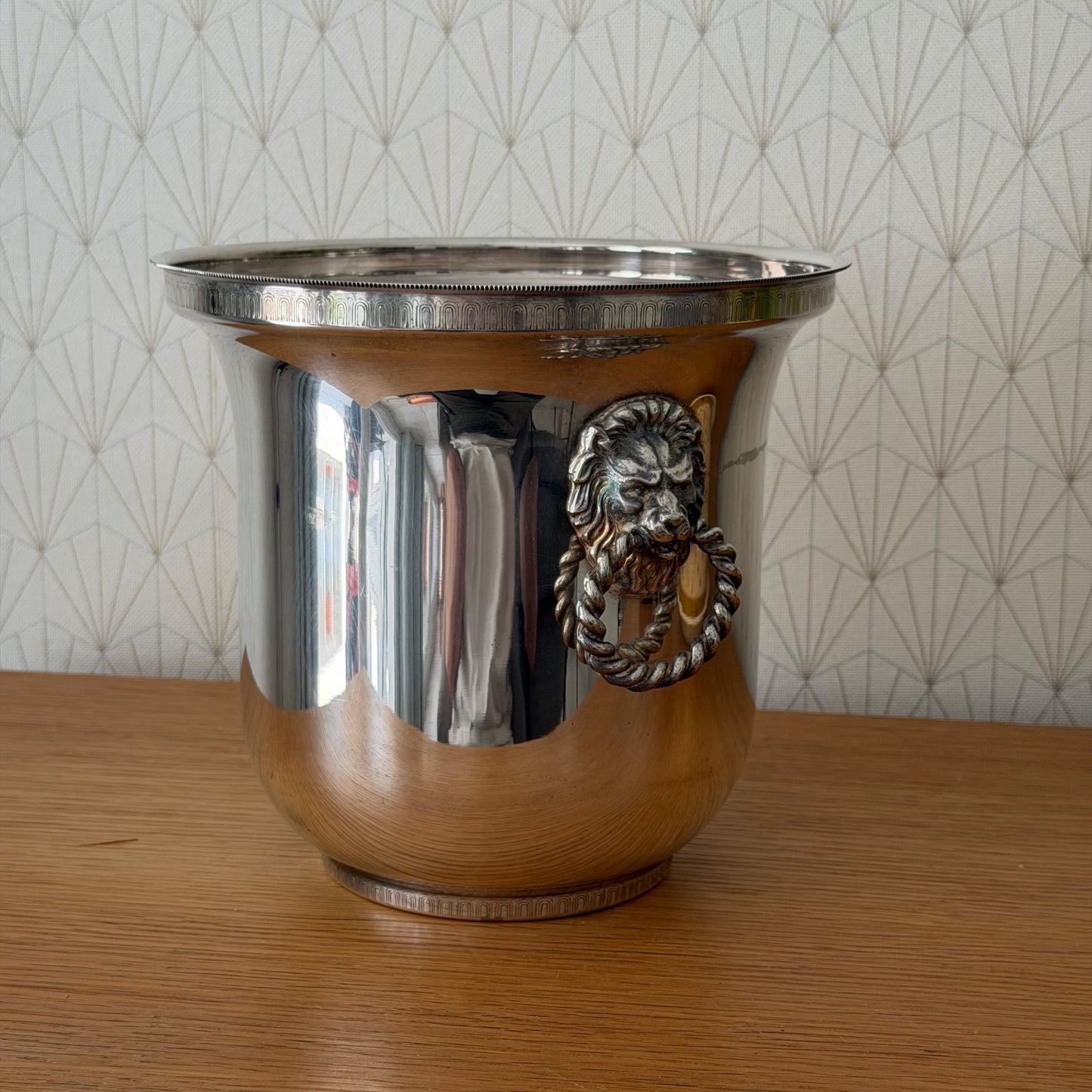 Front view of French ice bucket showing detailed lion handle with rope design