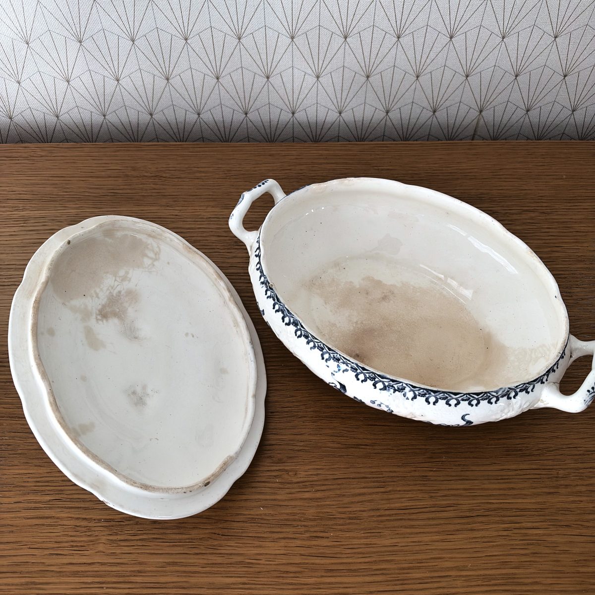 Interior view of French blue white transferware tureen with lid removed, showing undecorated cream interior and base.