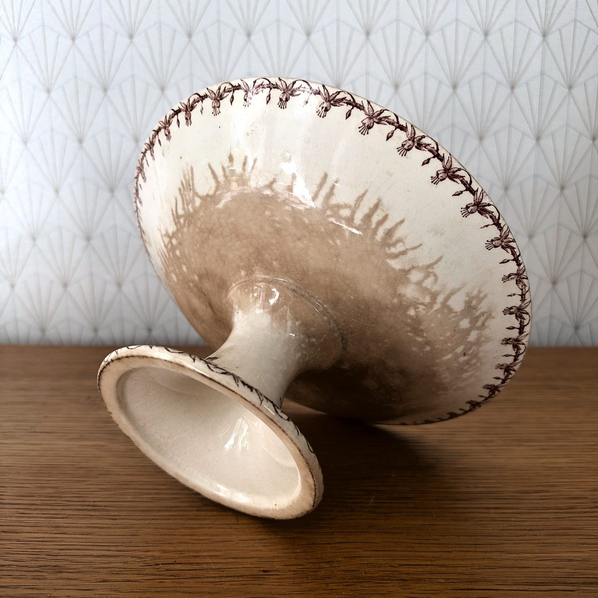Underside view of the Gien pedestal cake stand showing crazing and decorative border on the reverse of the bowl.