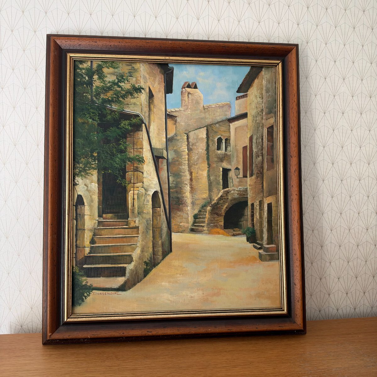 Full view of vintage French oil painting by Dorgendial showing medieval stone buildings with exterior staircases and a lantern, in dark wood frame.
