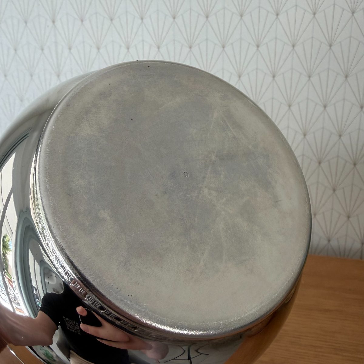 Base of vintage French silver plated champagne bucket showing plain pewter-tone unfinished underside typical of silver plate production.
