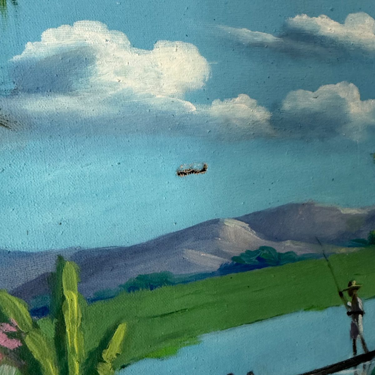 Close-up detail of the sky and background in the oil painting showing clouds, mountains, green fields, a fisherman, and a small painted aircraft in the blue sky