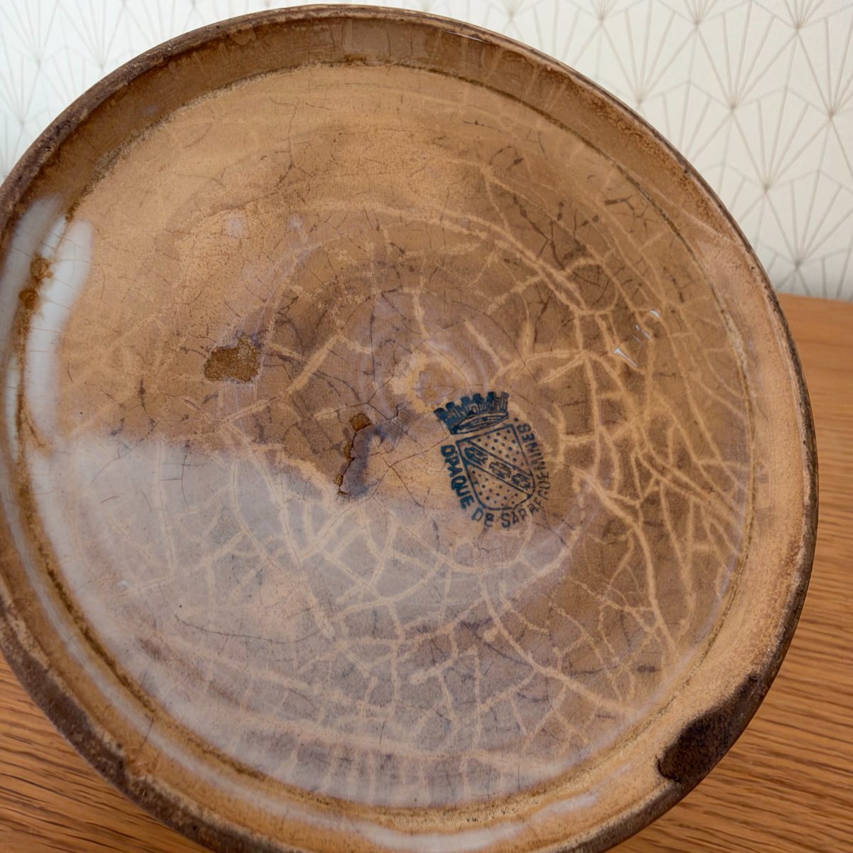 Base of antique French Sarreguemines stoneware crock showing blue stamp mark reading Opaque de Sarreguemines.